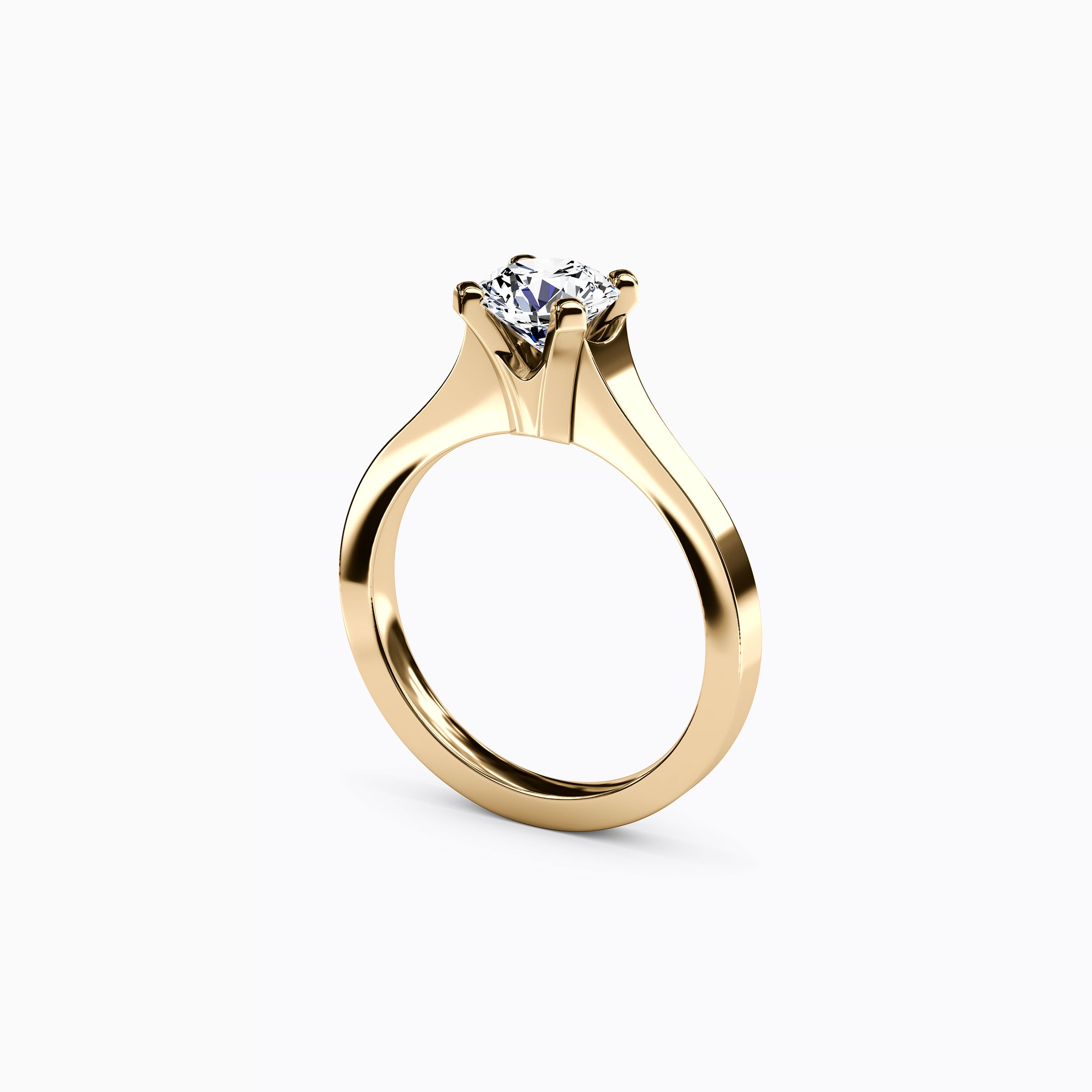 Bague de fiançailles solitaire en or 18 carats, sertie d'un diamant conique.