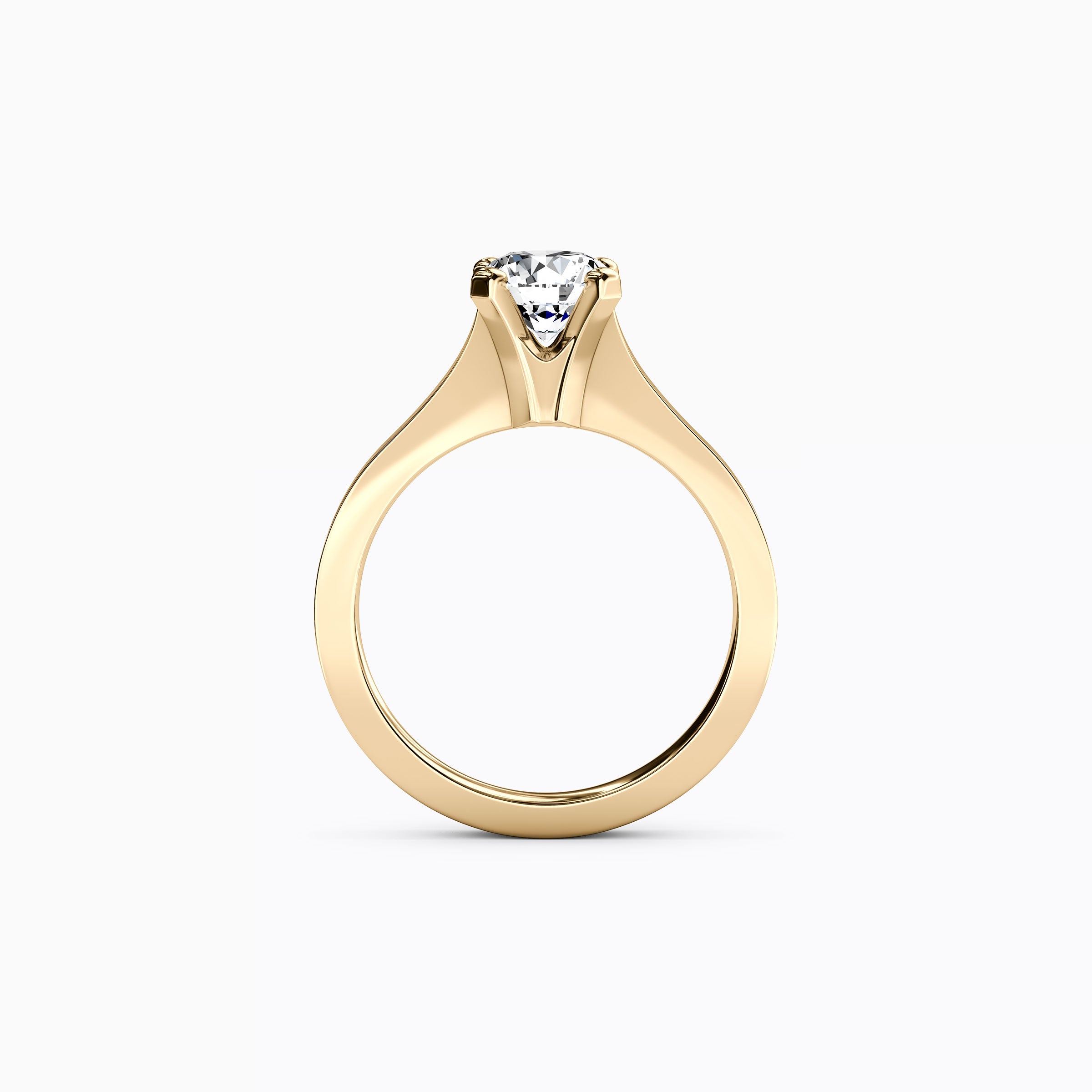 Bague de fiançailles solitaire en or 18 carats, sertie d'un diamant conique.